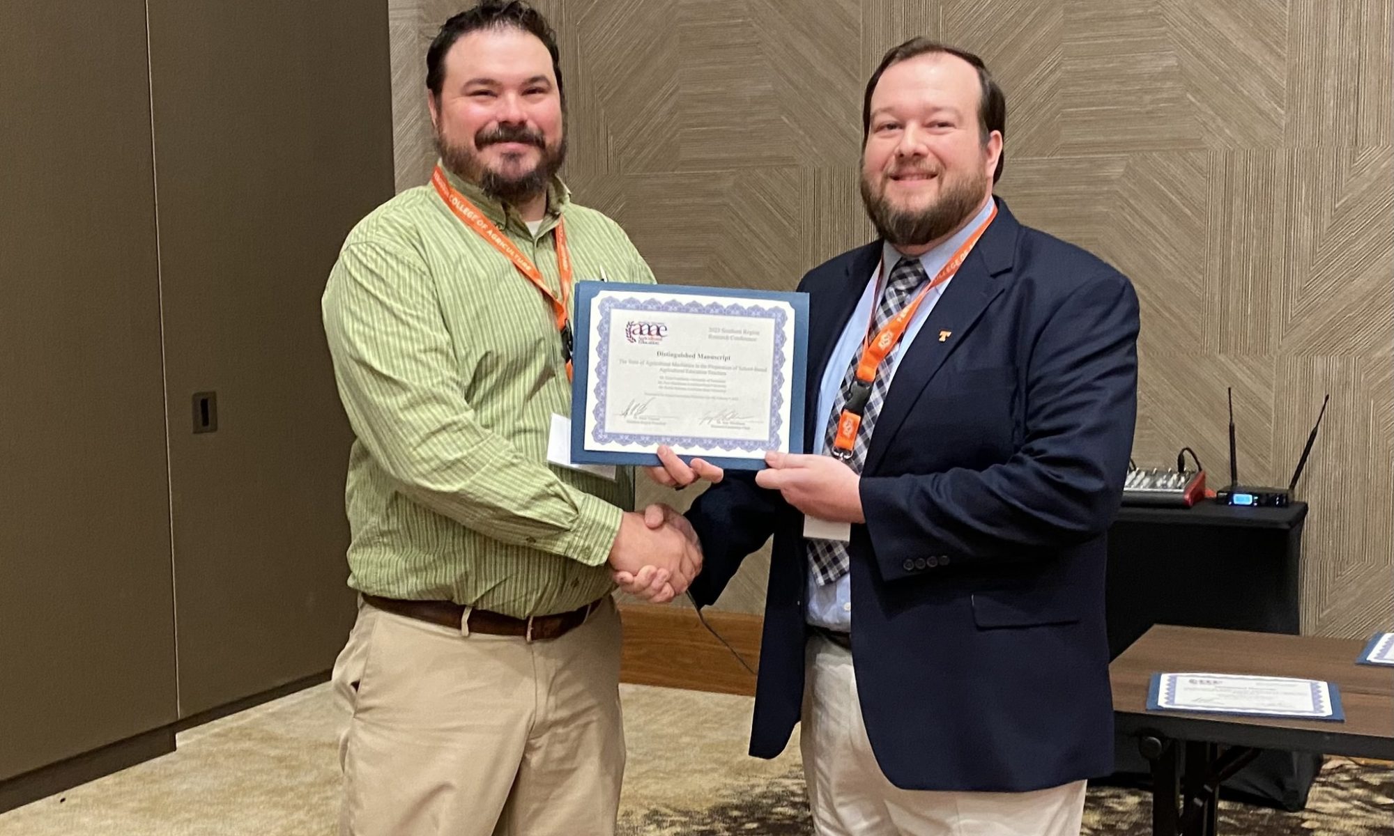 Dr. Tyler Granberry receives the Distinguished Manuscript award.